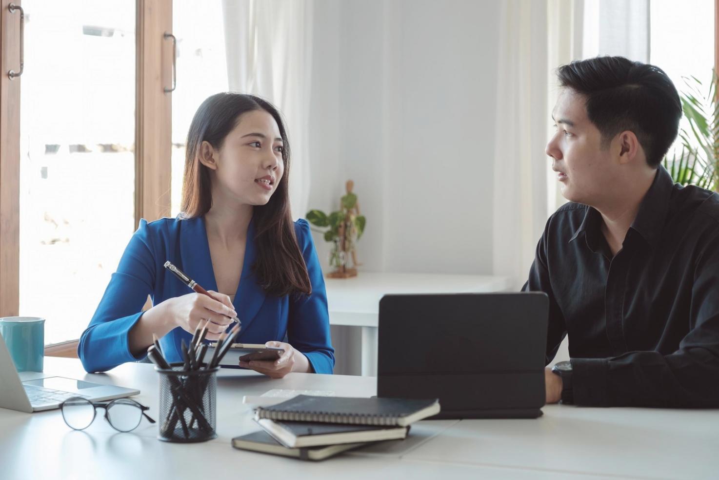 Insurance consultation meeting with documents and analysis